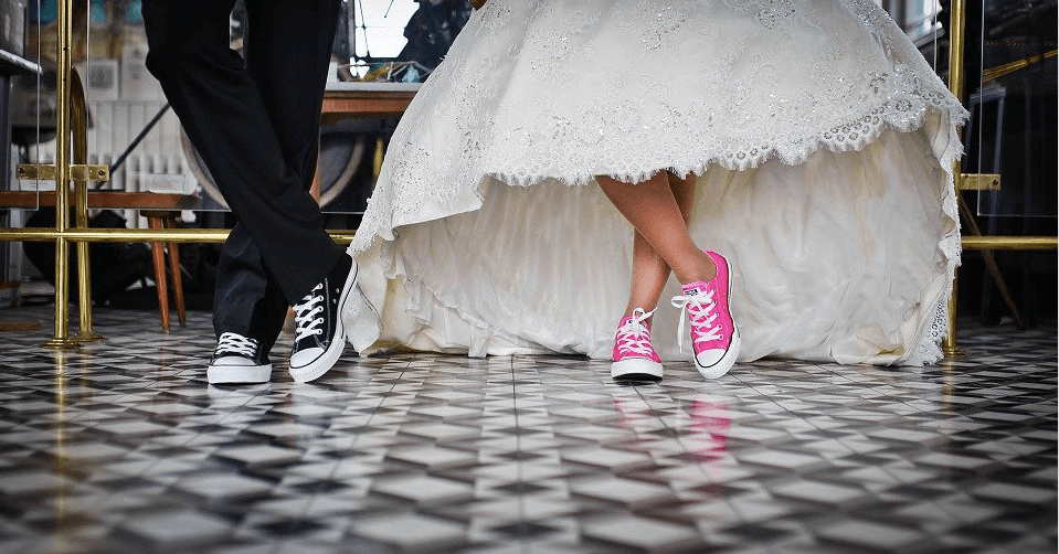 bride and groom with sneakers on
