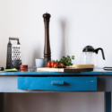 Blue table with kitchen utensils