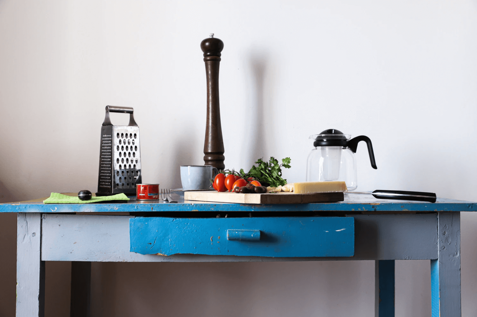 Blue table with kitchen utensils